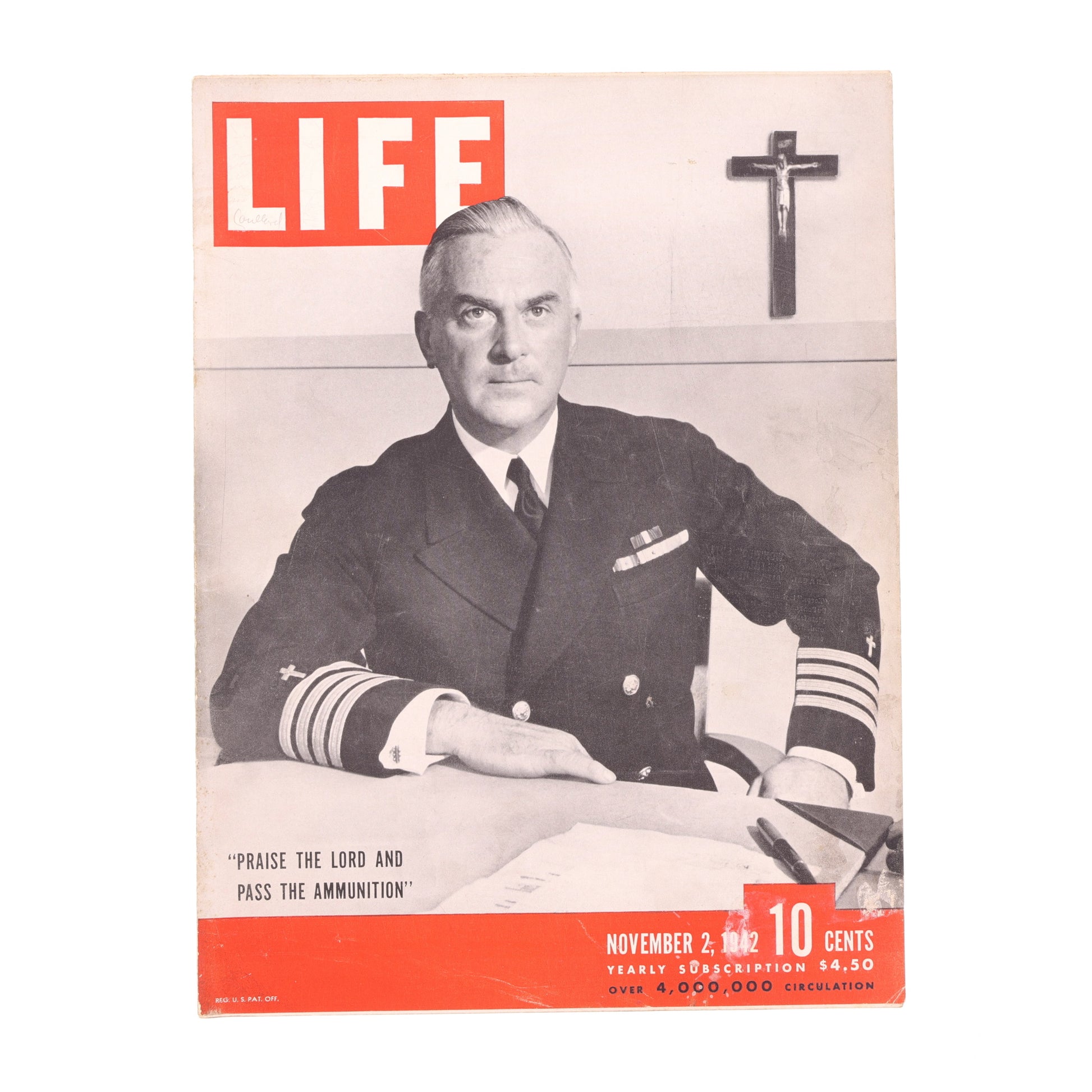 Magazine cover featuring a man in military uniform with a cross on the wall.