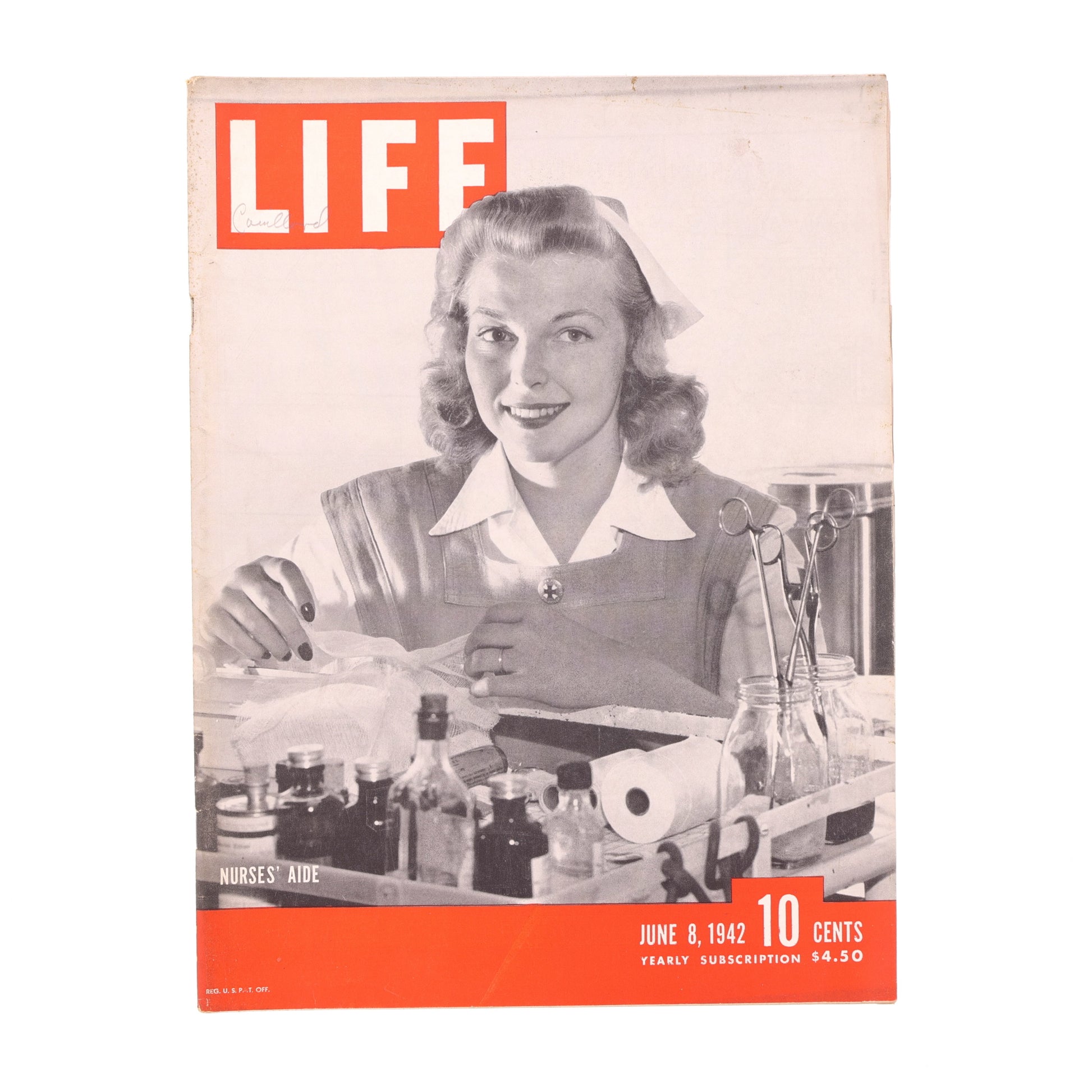 Vintage magazine cover of 'LIFE' featuring a woman in a lab setting.