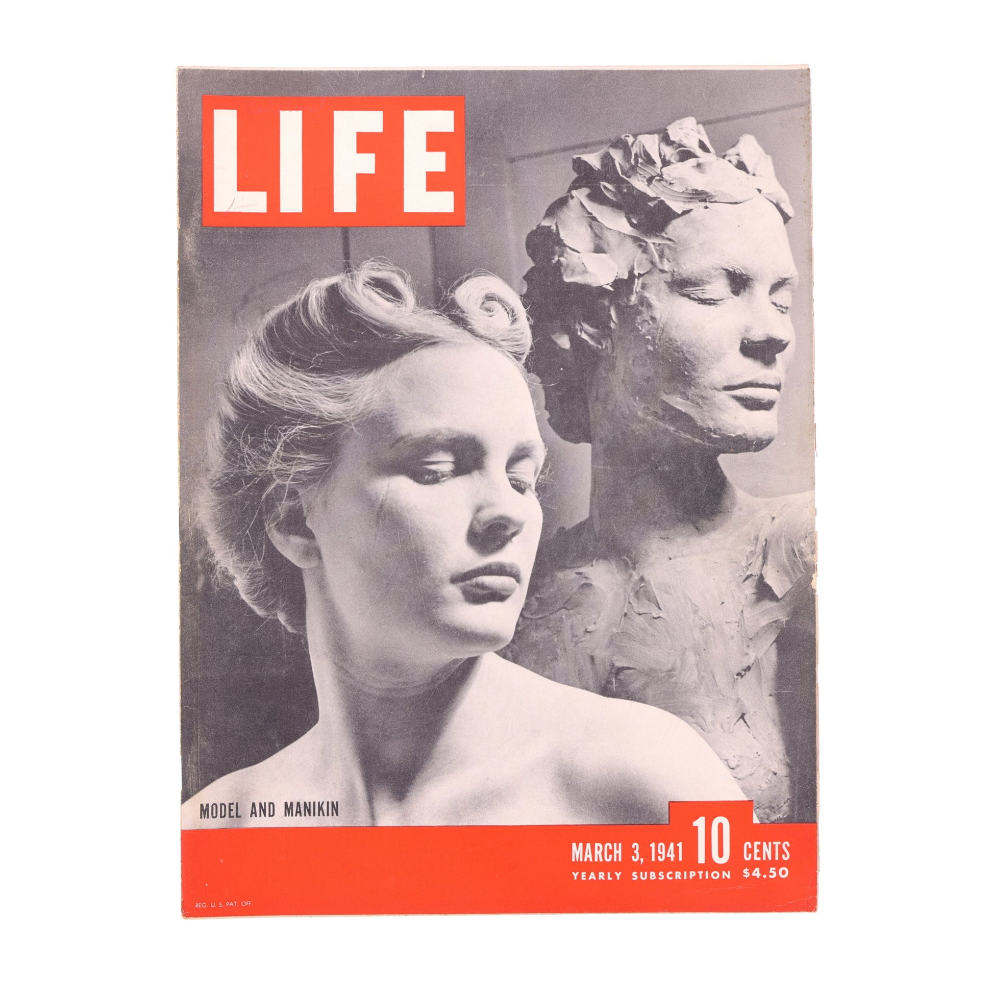 Vintage 'LIFE' magazine cover with a woman and statue, featuring the magazine's logo and price.