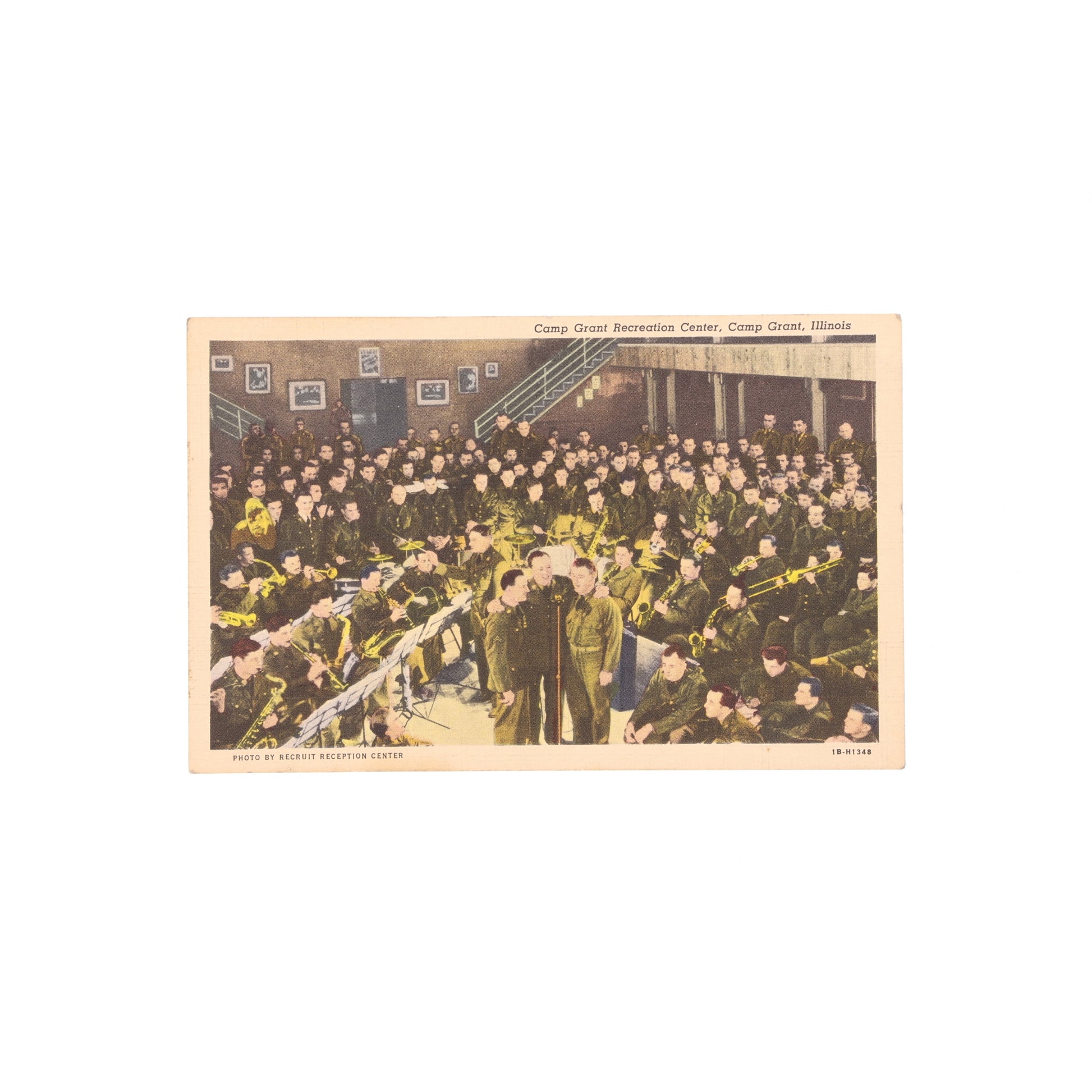 Vintage postcard of a large indoor gathering with people in military uniforms at Camp Grant