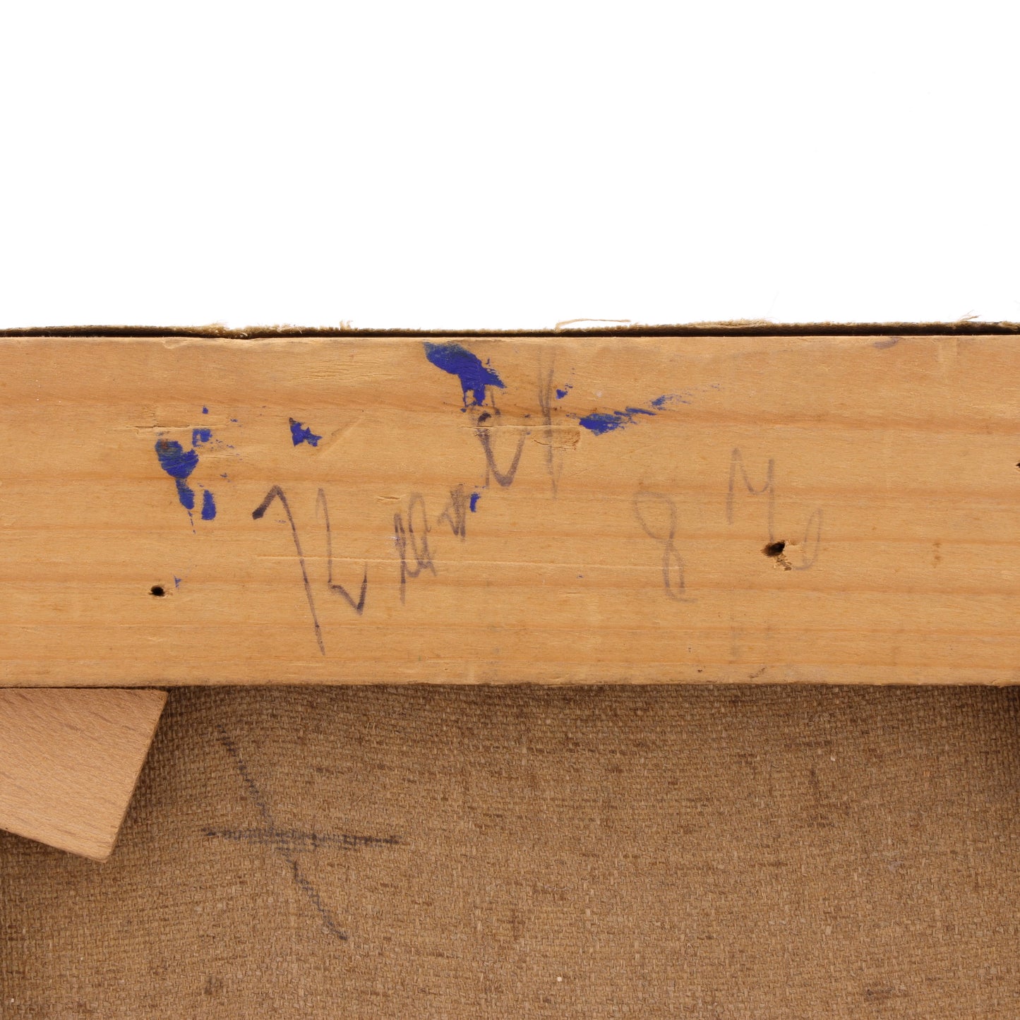 Wooden surface with signatures and markings on a white background