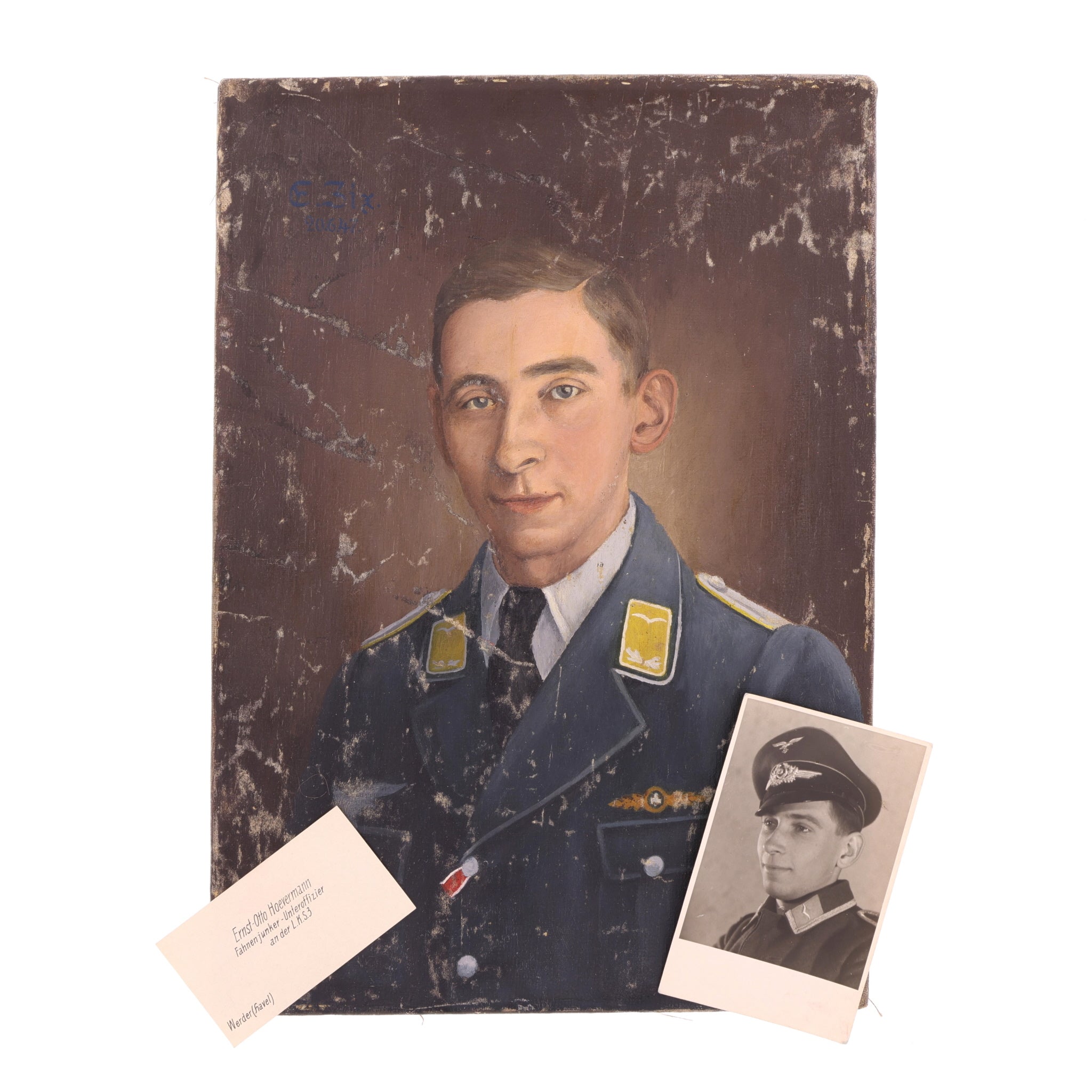 Vintage portrait of a man in military uniform with a smaller photo of another person in uniform.