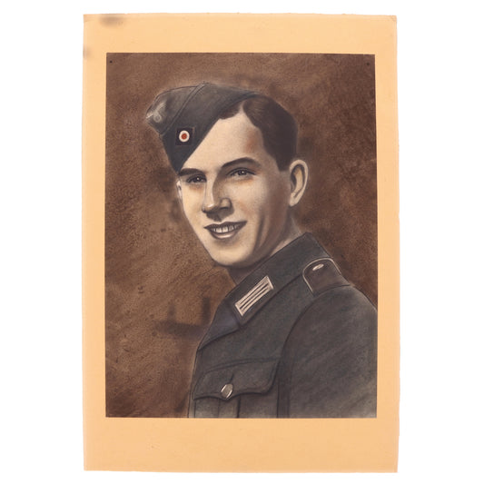 Vintage portrait of a man in military uniform with a red and white insignia on his cap.