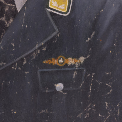Close-up of a dark fabric with embroidered designs and a button.