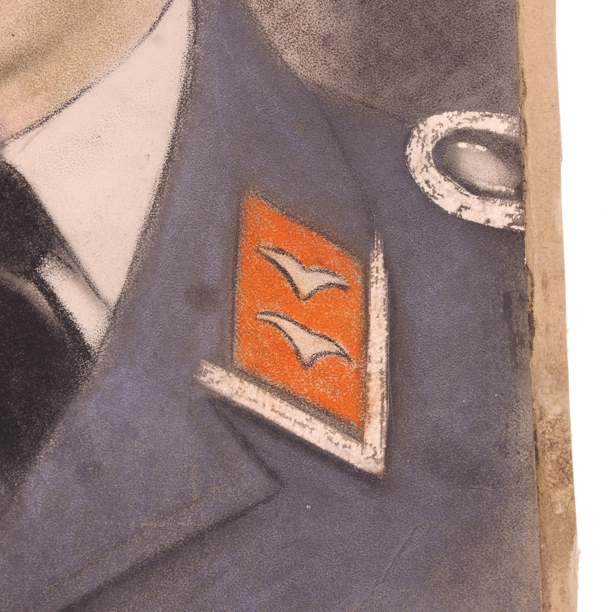 Close-up of a military uniform with an emblem featuring two birds on a red background.
