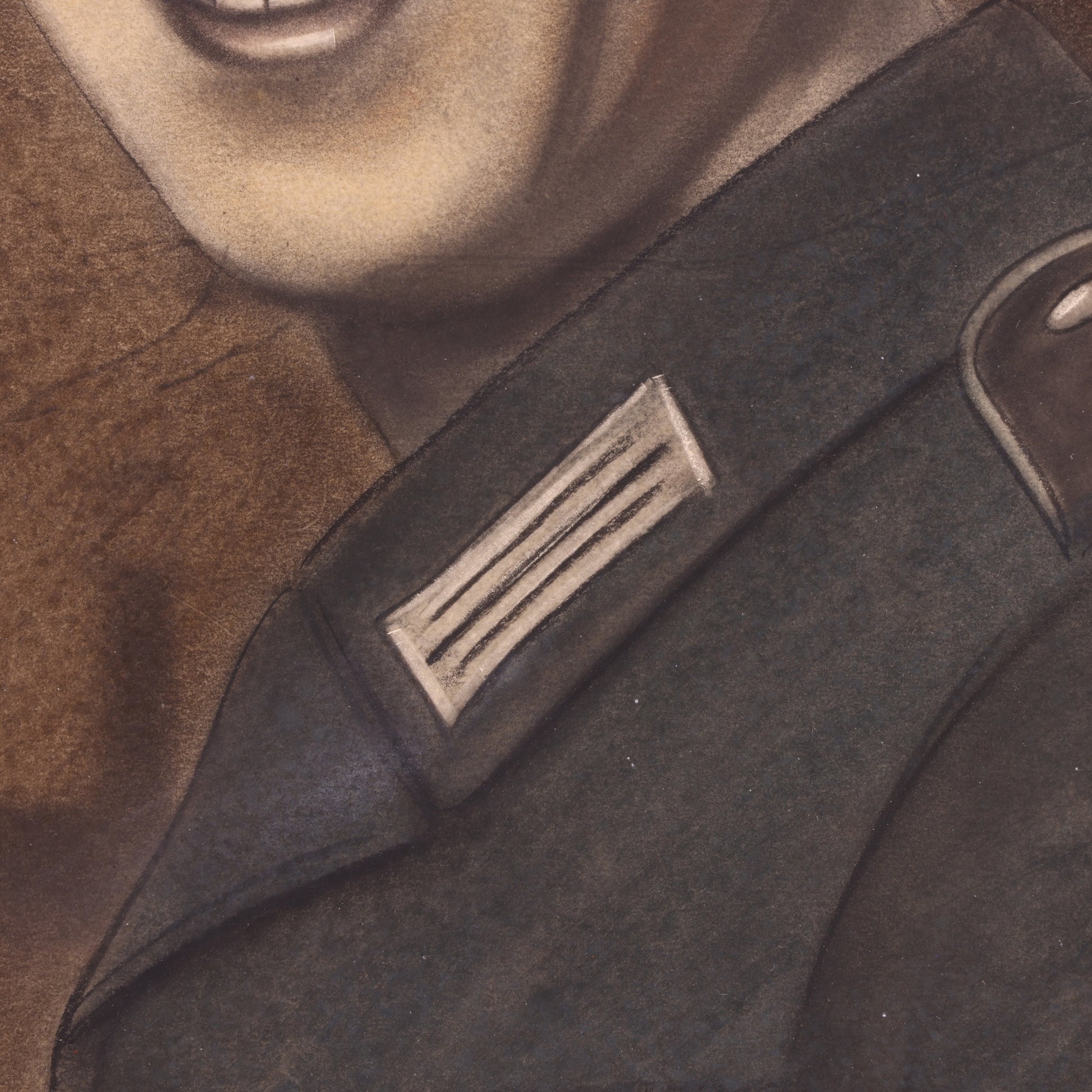 Close-up of a military uniform with a badge